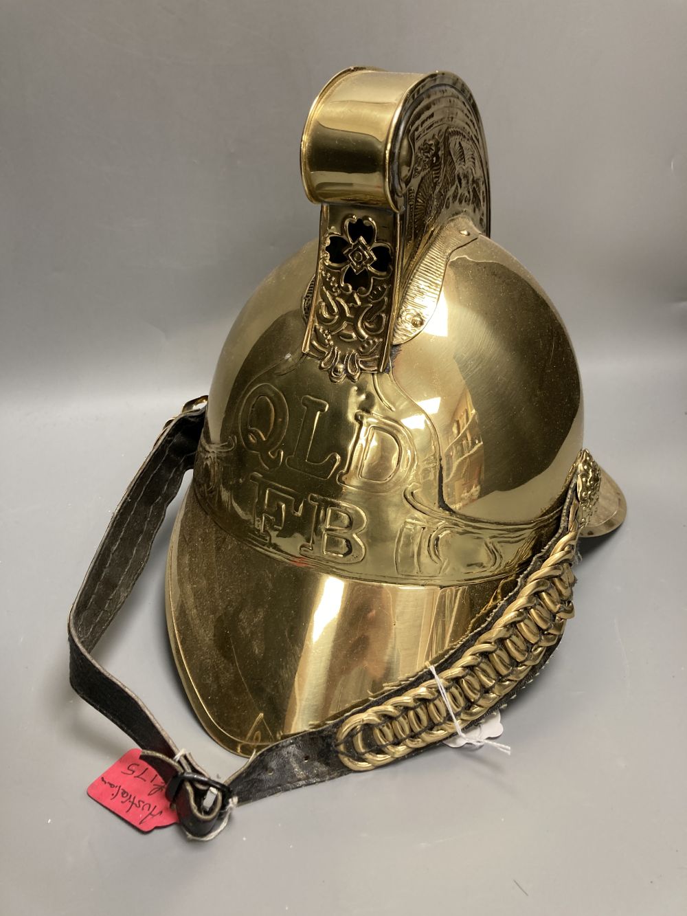 A reproduction brass firemans helmet, height 27cm